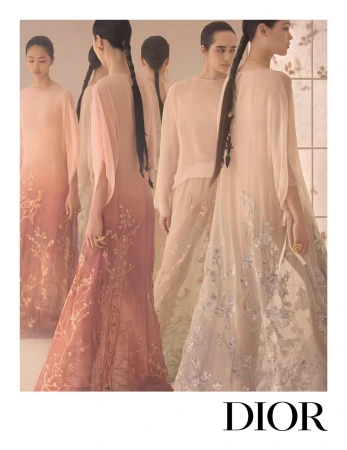 Models in flowing embroidered pastel dresses posing against a neutral interior background for Dior Fall 2025 campaign.
