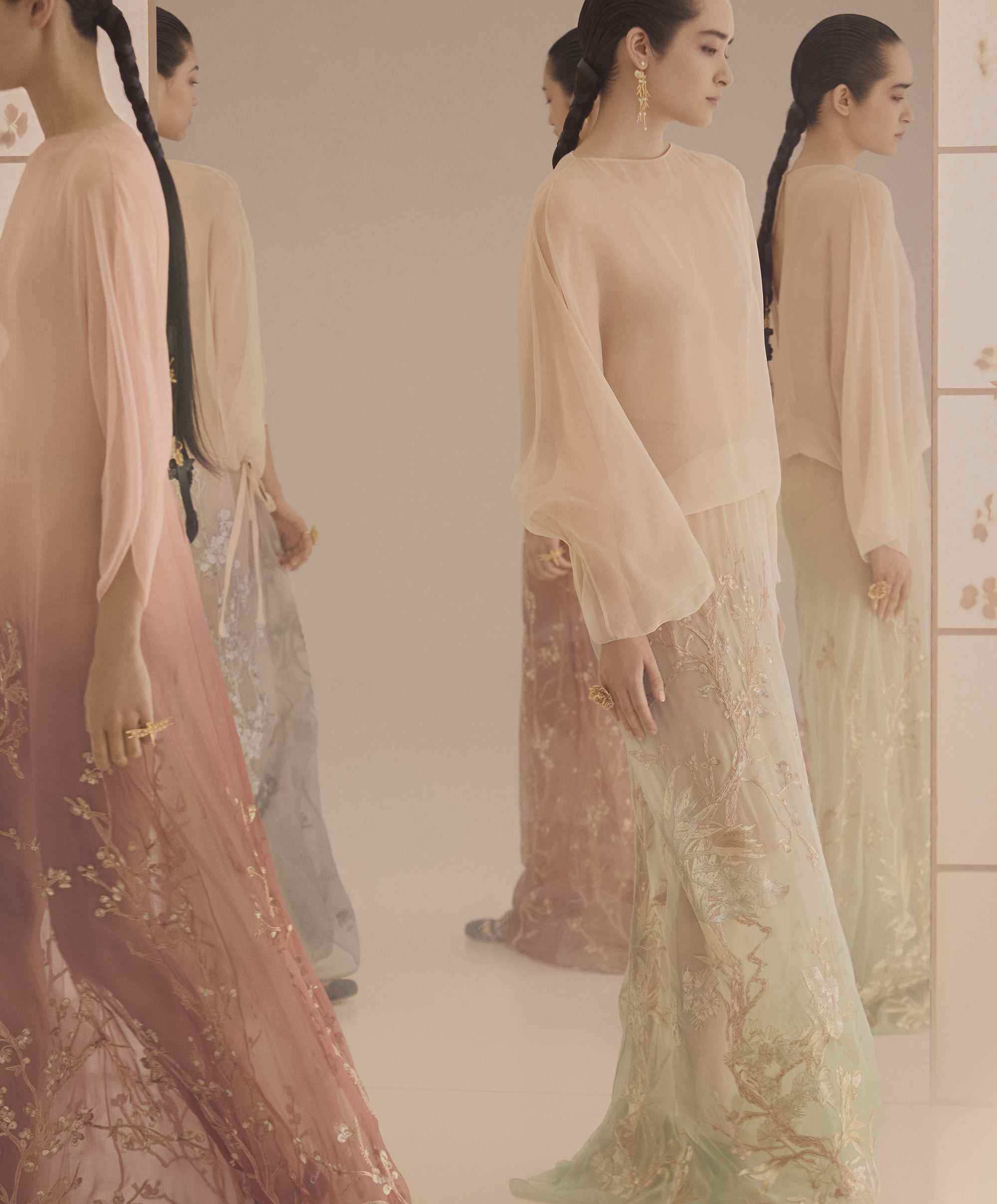 Models in long sheer gowns posing before mirrored panels for Dior Fall 2025 ad campaign captured by Yuriko Takagi