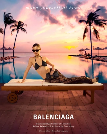 Model wearing dark sunglasses and a black bikini lounging on a wooden poolside lounger at sunset with palm trees in the background
