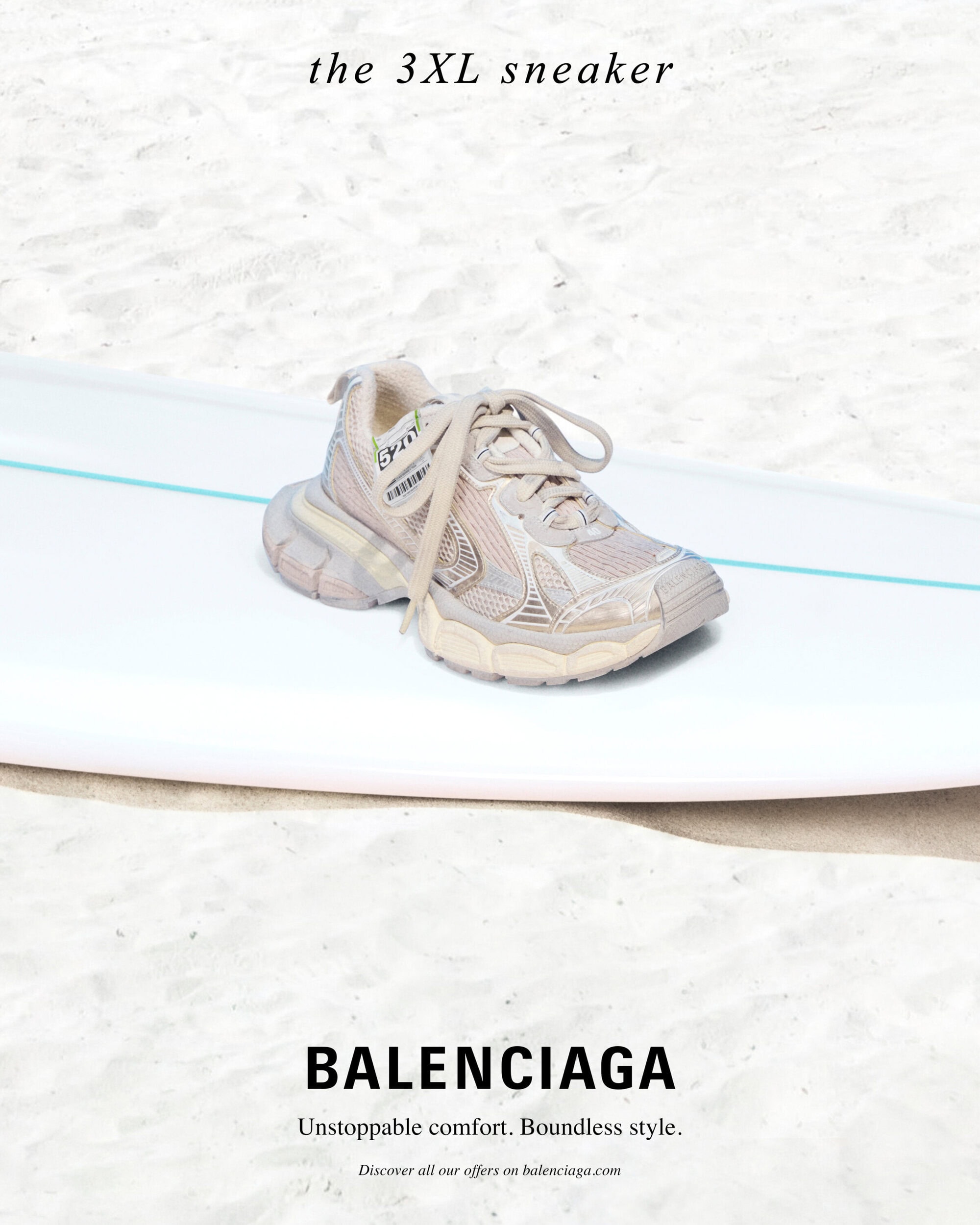Balenciaga 3XL sneaker resting on a white surfboard set against a sandy beach background