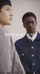 Two male models posing against a neutral backdrop for Maison Kitsune Spring 2025 campaign