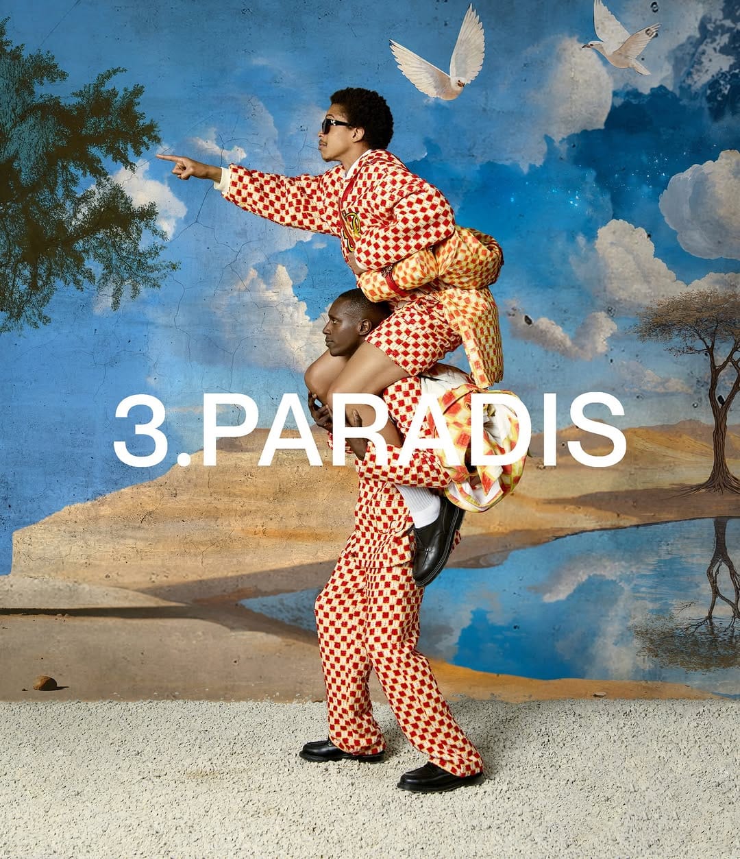 Two models wearing red and white patterned checkered matching outfits against a painted sky backdrop with flying white doves.