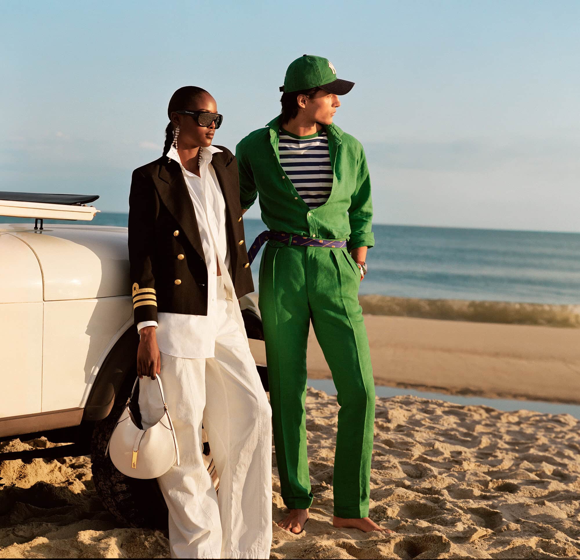 Models standing on a sandy beach next to a white vintage car during golden hour for Ralph Lauren Ralph's Hamptons campaign.