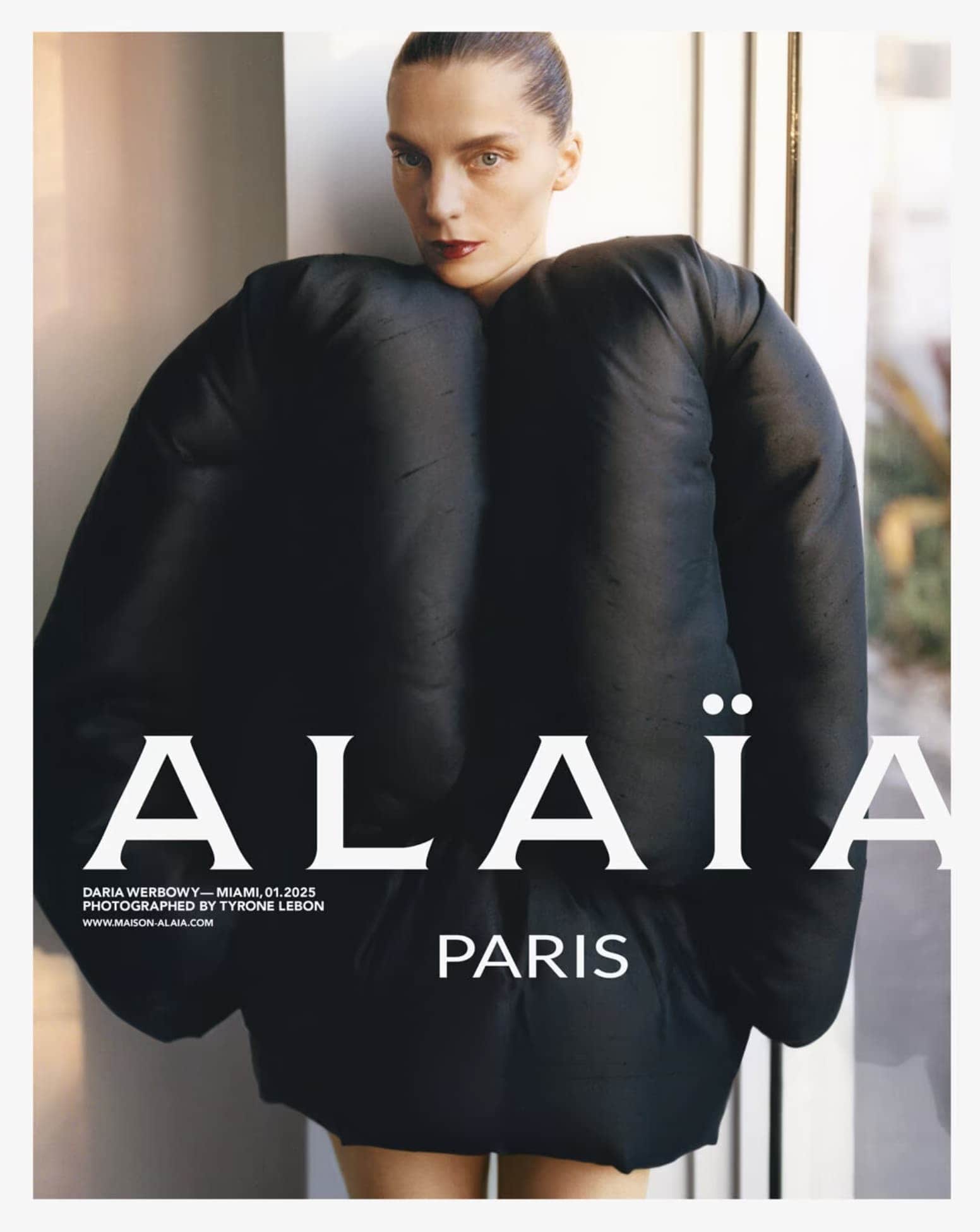 Daria Werbowy wearing a black sculptural padded garment for Alaïa photographed by Tyrone Lebon