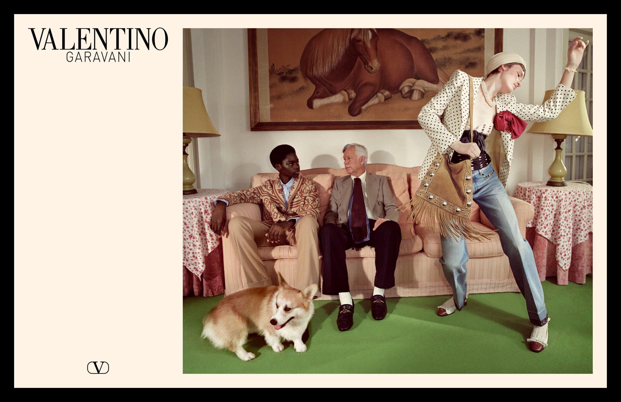 Valentino spring ad campaign featuring models in a living room with a corgi and horse painting