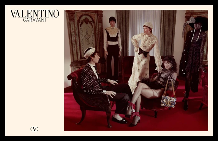 Valentino Garavani spring 2025 ad campaign featuring models posed in a lavishly decorated interior with red carpeting.