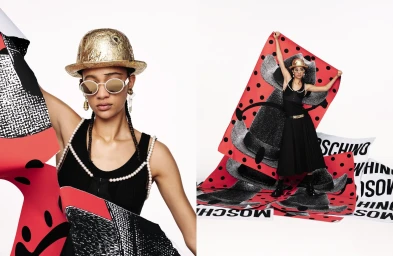 Model in a gold derby hat and black dress holding printed graphics in Moschino Spring 2025 ad campaign against white.