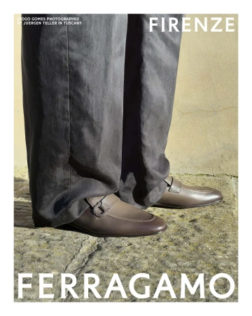 Close-up portrait of brown leather loafers and dark trousers standing on stone flooring for Ferragamo campaign