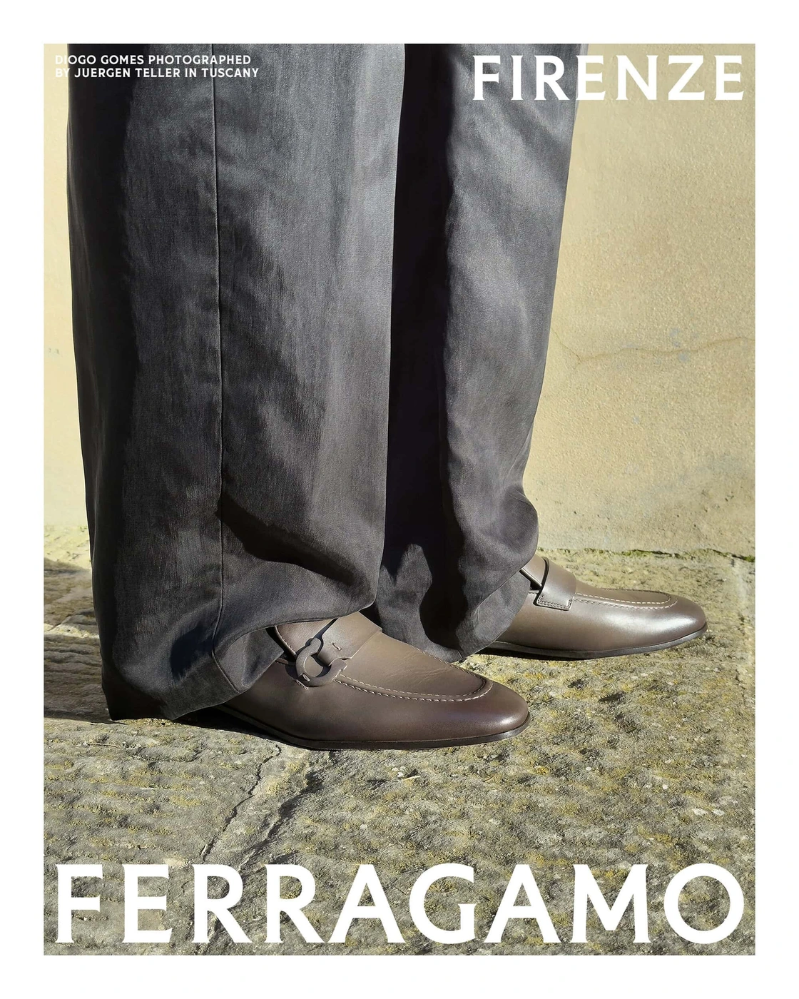 Close-up portrait of brown leather loafers and dark trousers standing on stone flooring for Ferragamo campaign