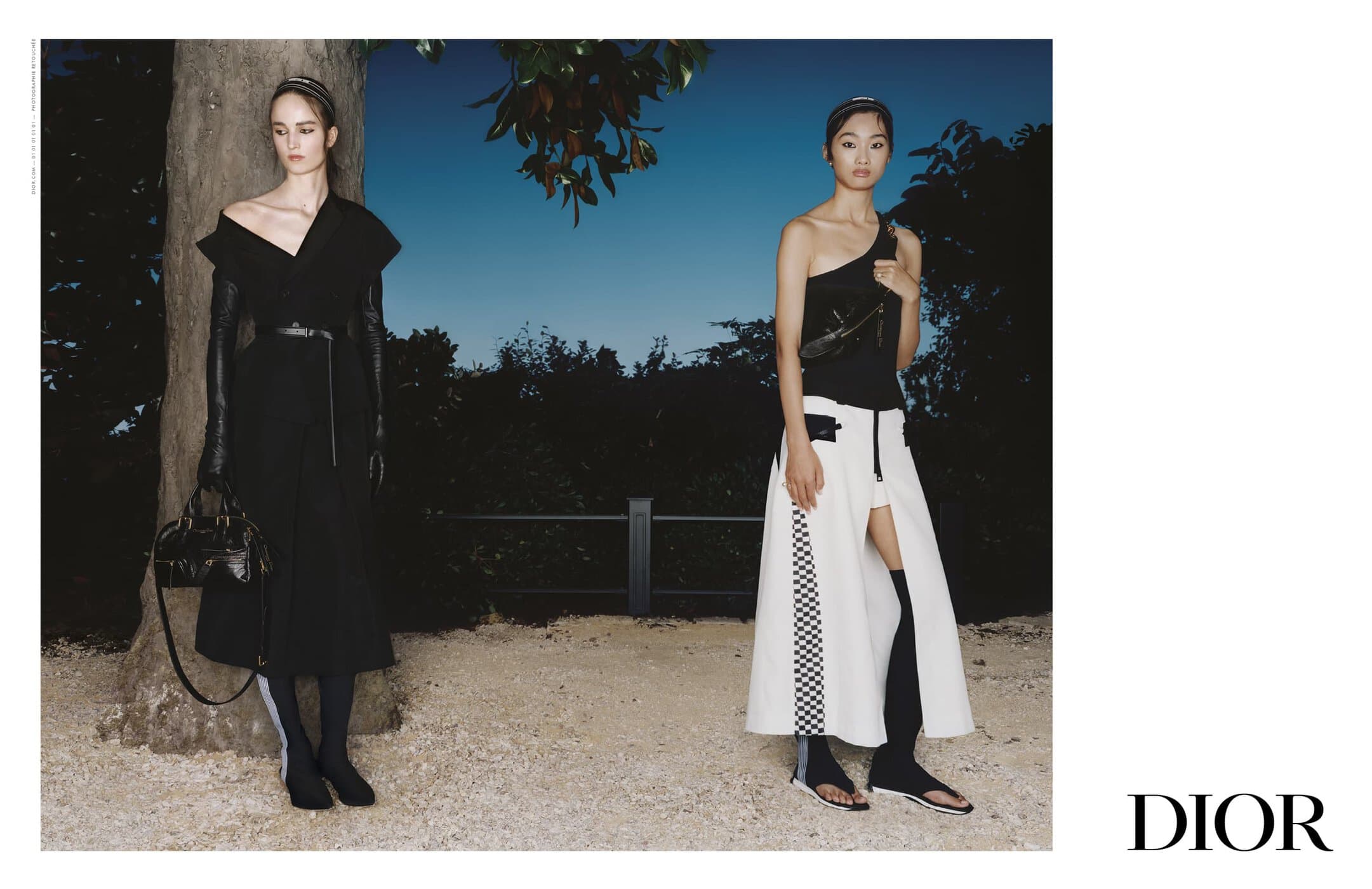Two female models posing outdoors at dusk for Dior Spring 2025 campaign, wearing black and white structured designer apparel.