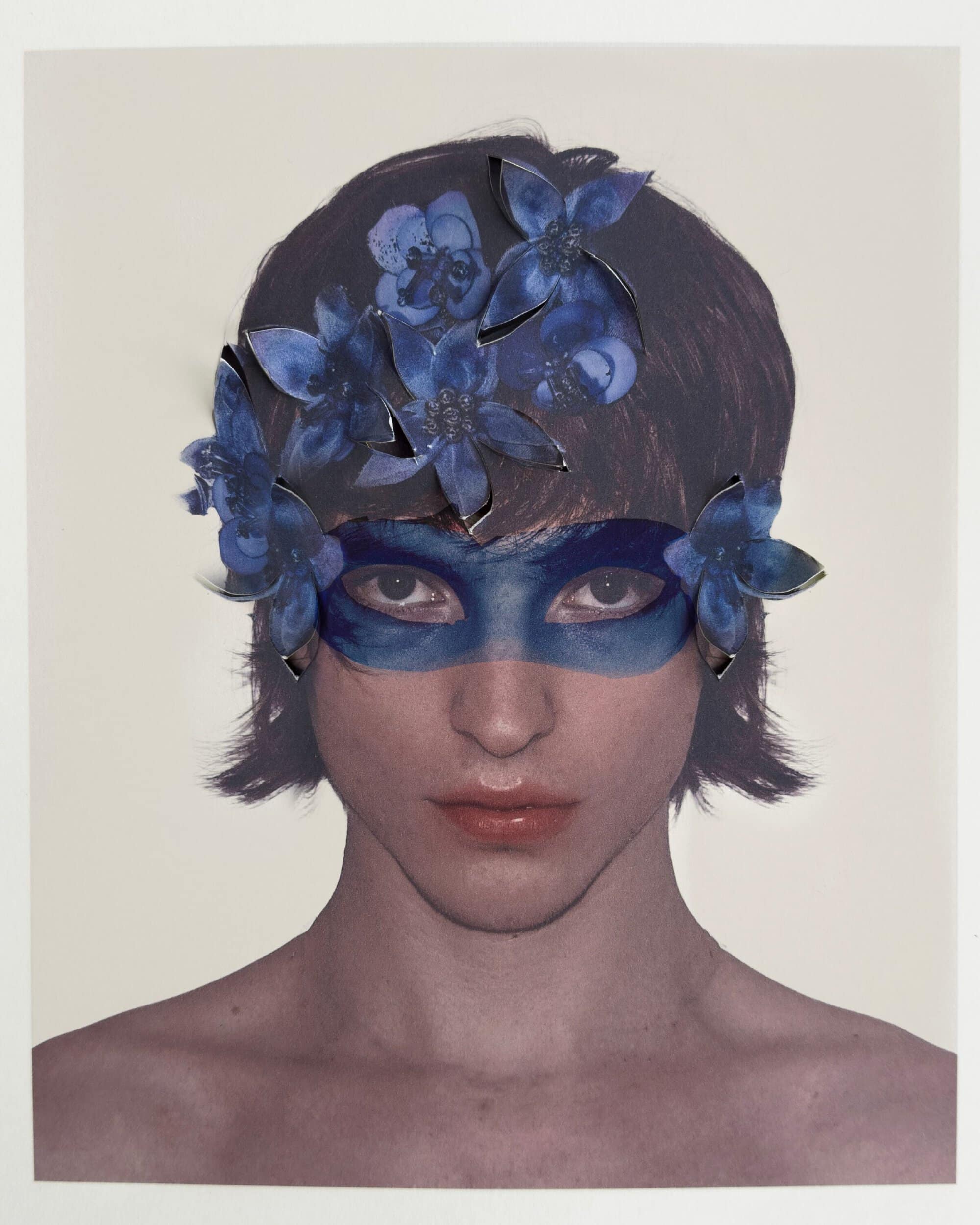 Portrait of a model wearing a blue floral mask and flower headpiece for Paul Andrew Spring 2025 campaign
