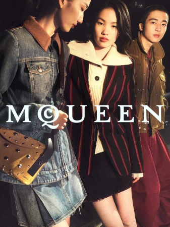 Three models wearing denim jacket, striped blazer, and jacket in an ad campaign for McQueen with bold serif branding typography