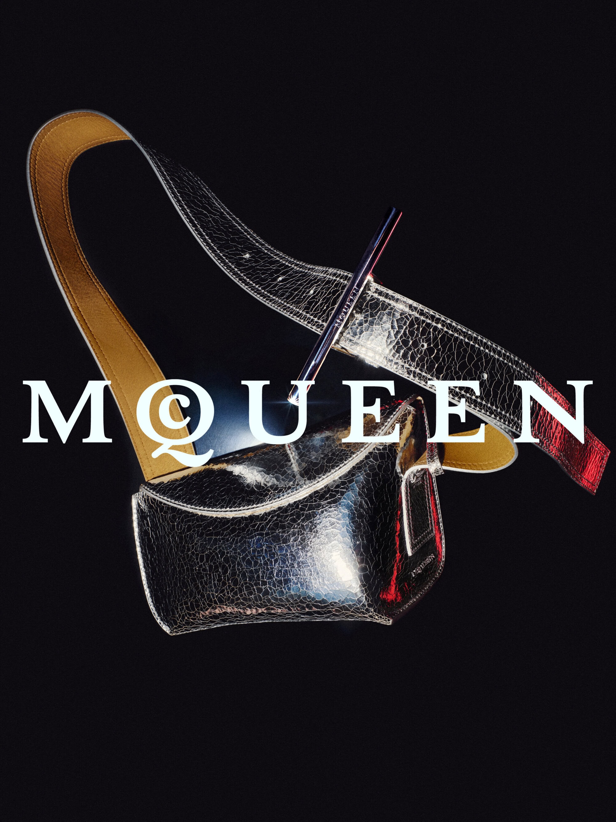Glossy black textured leather bag with a long strap against a dark background featuring bold white text.