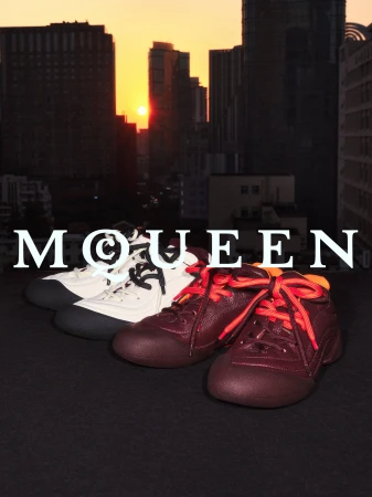 Two pairs of designer sneakers arranged on a dark surface against an urban sunset skyline backdrop with bold white text overlay.