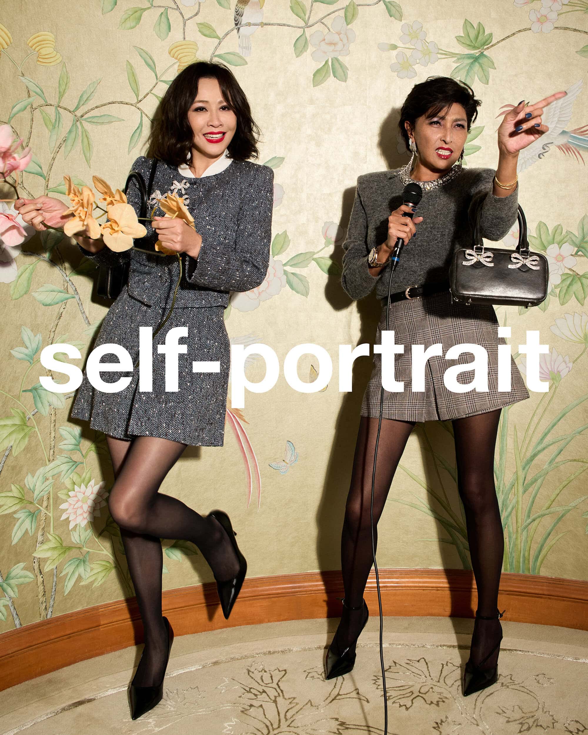 Two women posing indoors against a floral wallpaper background for Self-Portrait Lunar New Year campaign