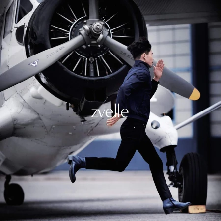 Man running past a large white airplane propeller in an ad campaign for Zvelle by photographer Daniel Harrison
