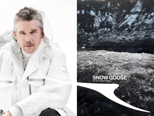 Ethan Hawke wearing a white hooded winter jacket against a white background next to a landscape view of a snowy mountain terrain