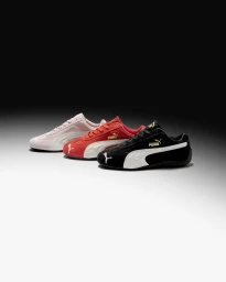 Three Puma Speedcat sneakers in black, red, and light pink arranged diagonally on a gradient studio backdrop.