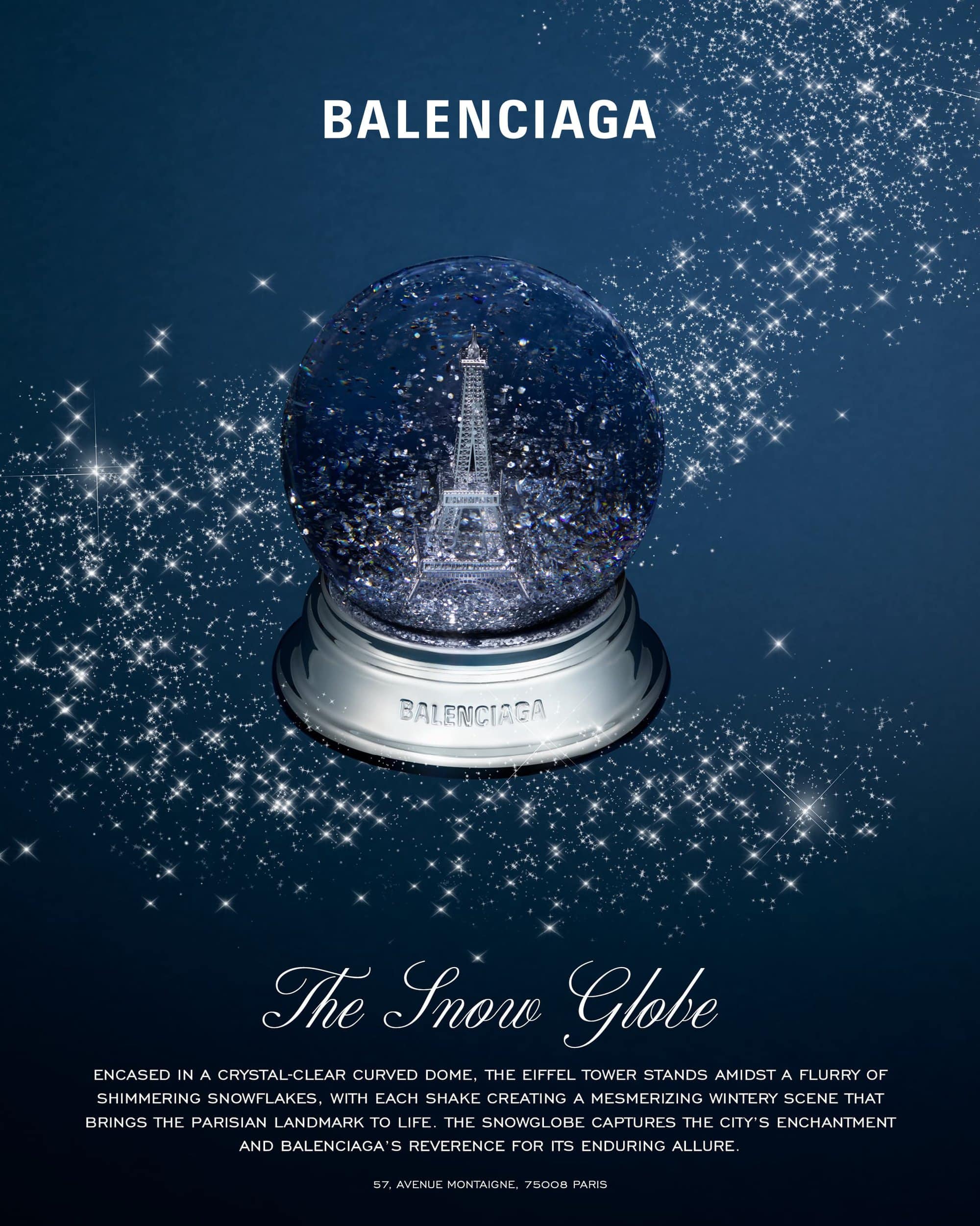Balenciaga snow globe featuring the Eiffel Tower on a dark blue background with glittering stars and white text below.