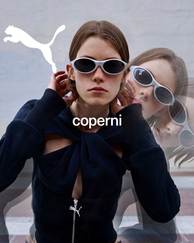 Model wearing white sunglasses and a black zip-up top with multiple exposure motion blur in the Fall 2024 ad campaign by Coperni x Puma.