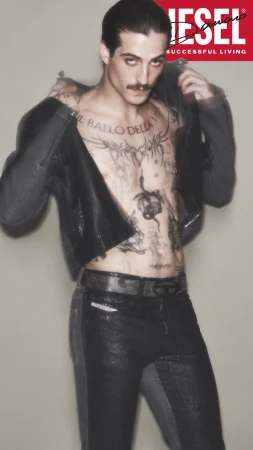 Damiano David in dark jacket and jeans against neutral studio background for Diesel Fall 2024 campaign