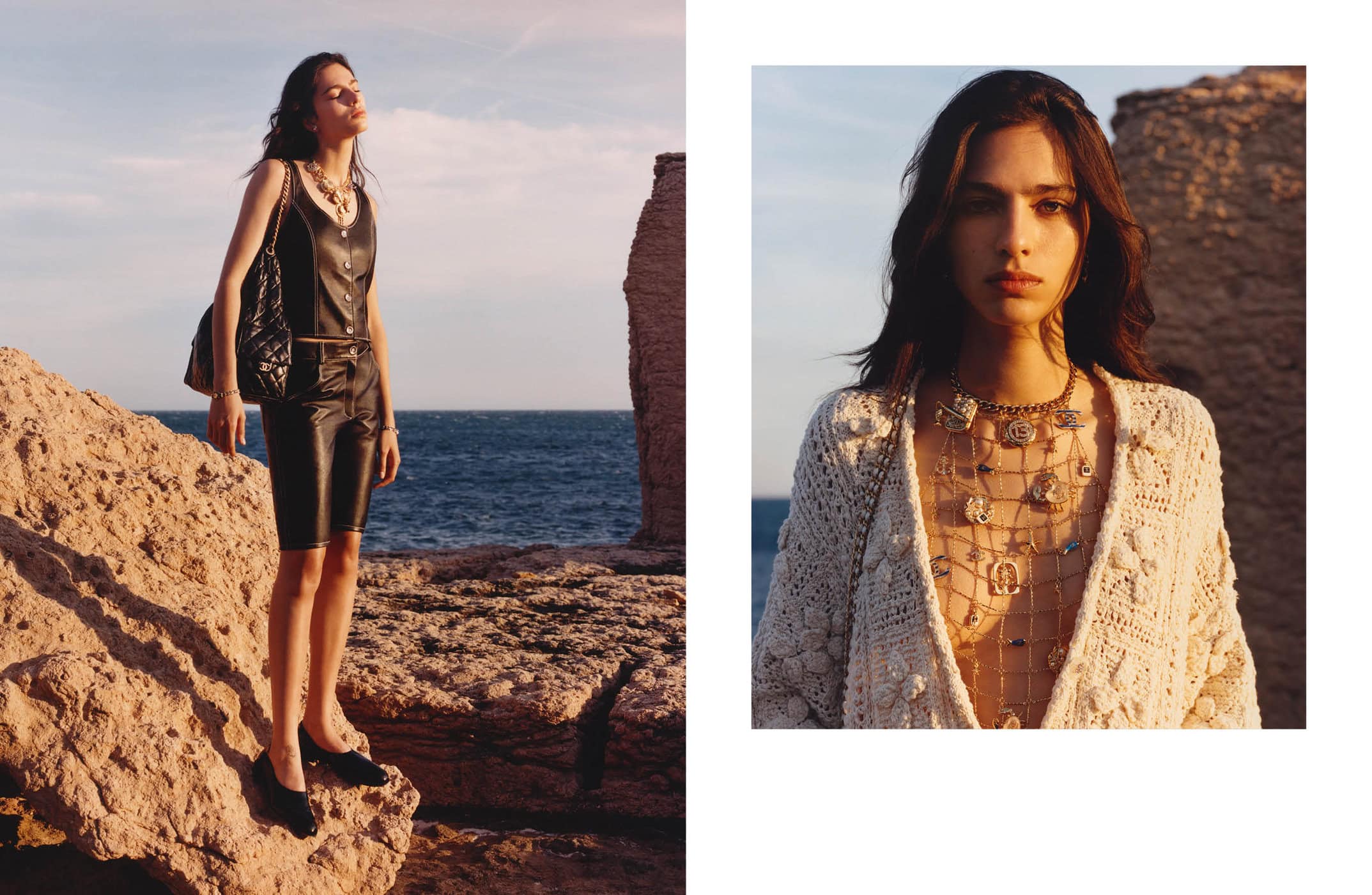 Model Loli Bahia standing on coastal rocks by the sea in a black leather outfit for the Chanel Cruise 2025 campaign shot by Jamie Hawkesworth.