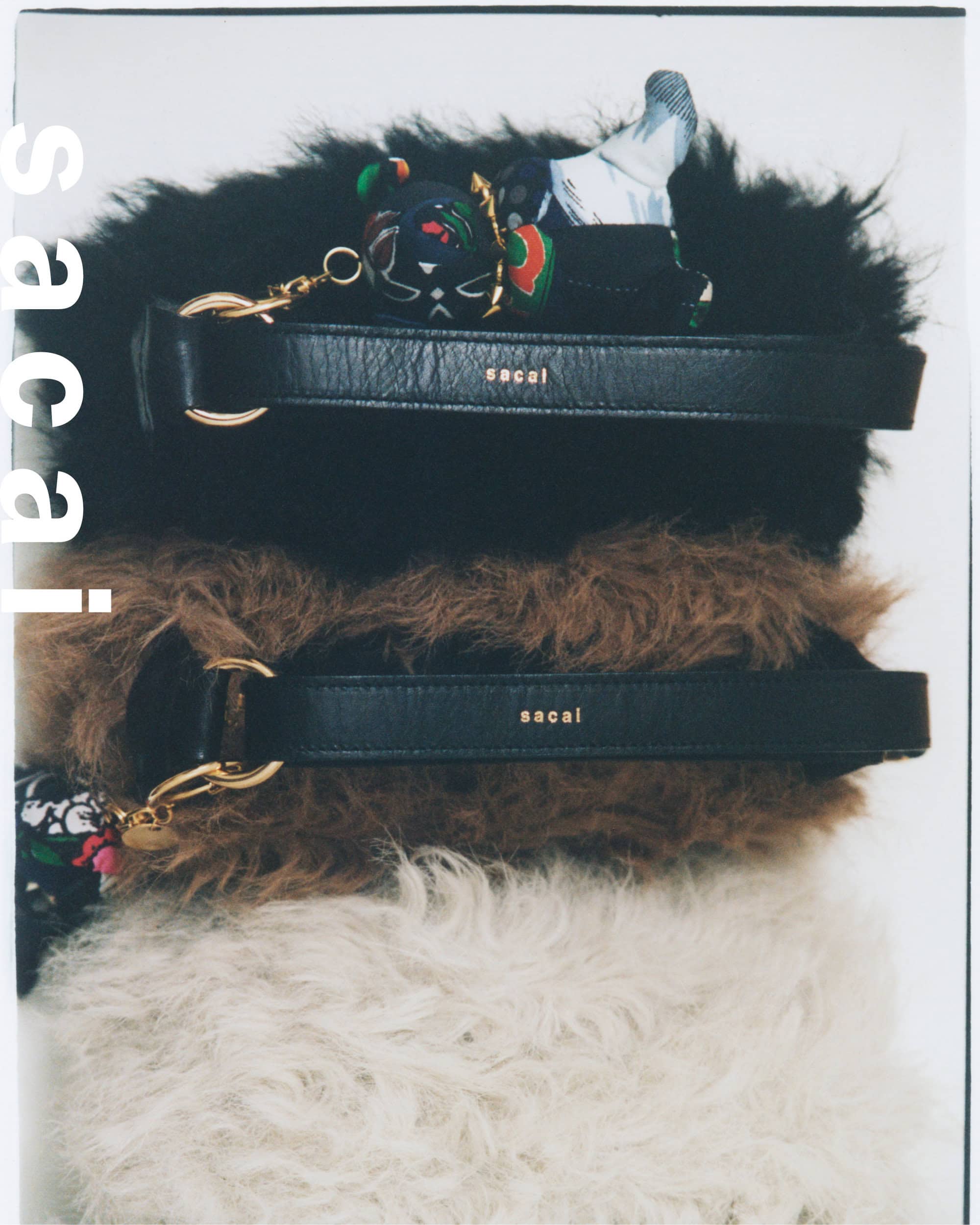 Three stacked furry shearling handbags with leather straps in black, brown, and white from the Sacai Holiday 2024 campaign.