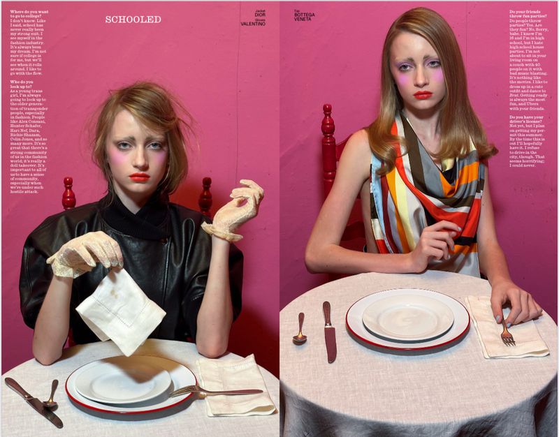 Fashion editorial spread features two pale-skinned models with bright makeup seated at tables with formal place settings against pink walls.