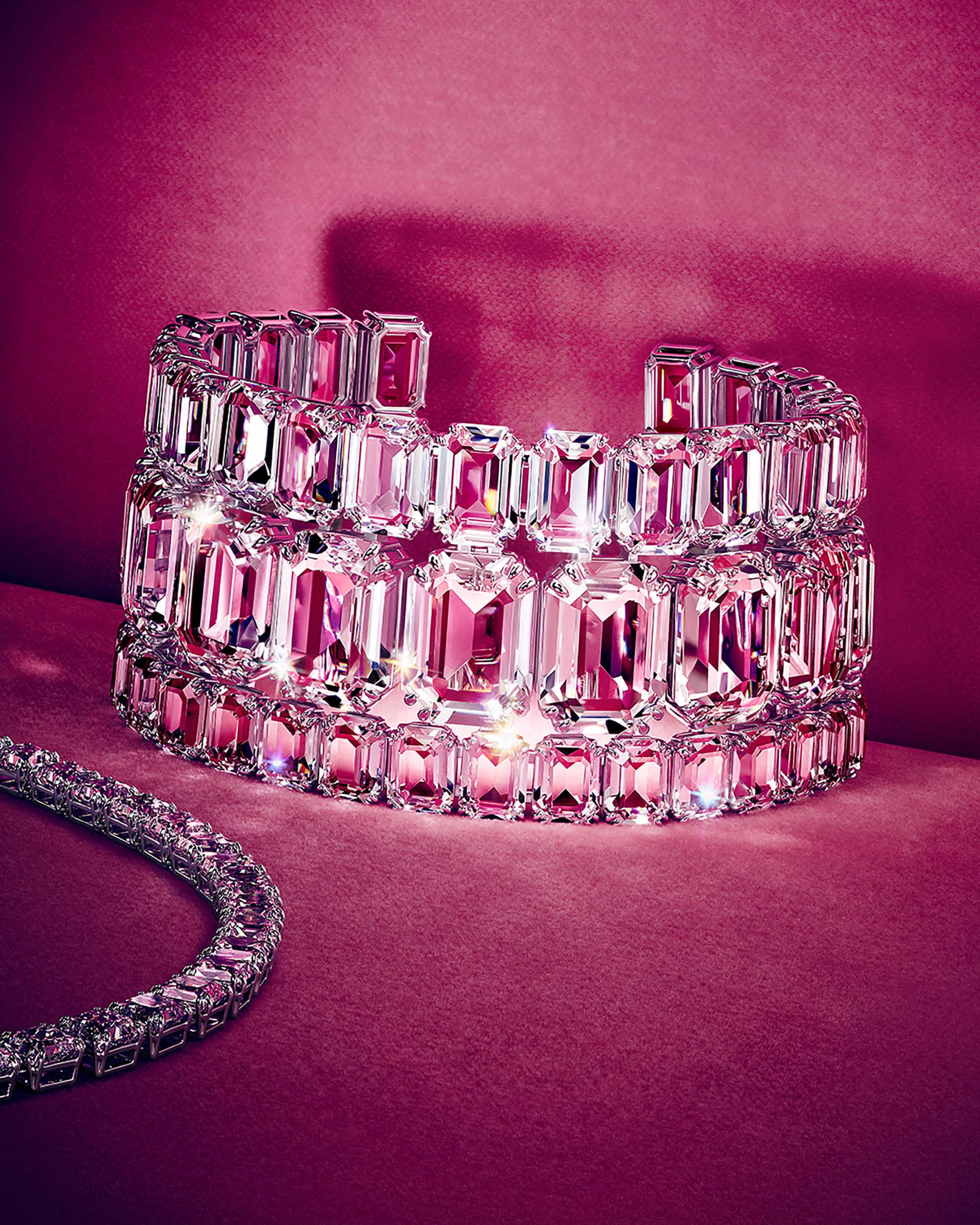 Crystal cuff bracelet and matching necklace against a rich pink velvet background
