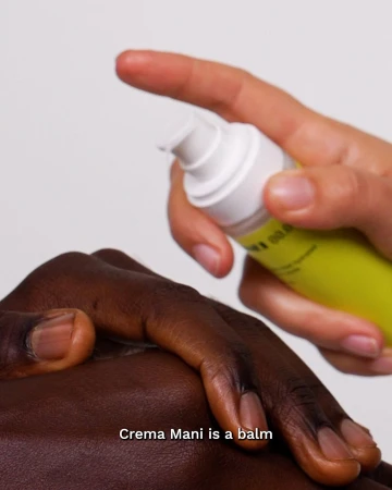 Close-up of hands applying hand balm from a pump bottle against a plain white background for the Sunnei x mid/night 00.00 campaign.