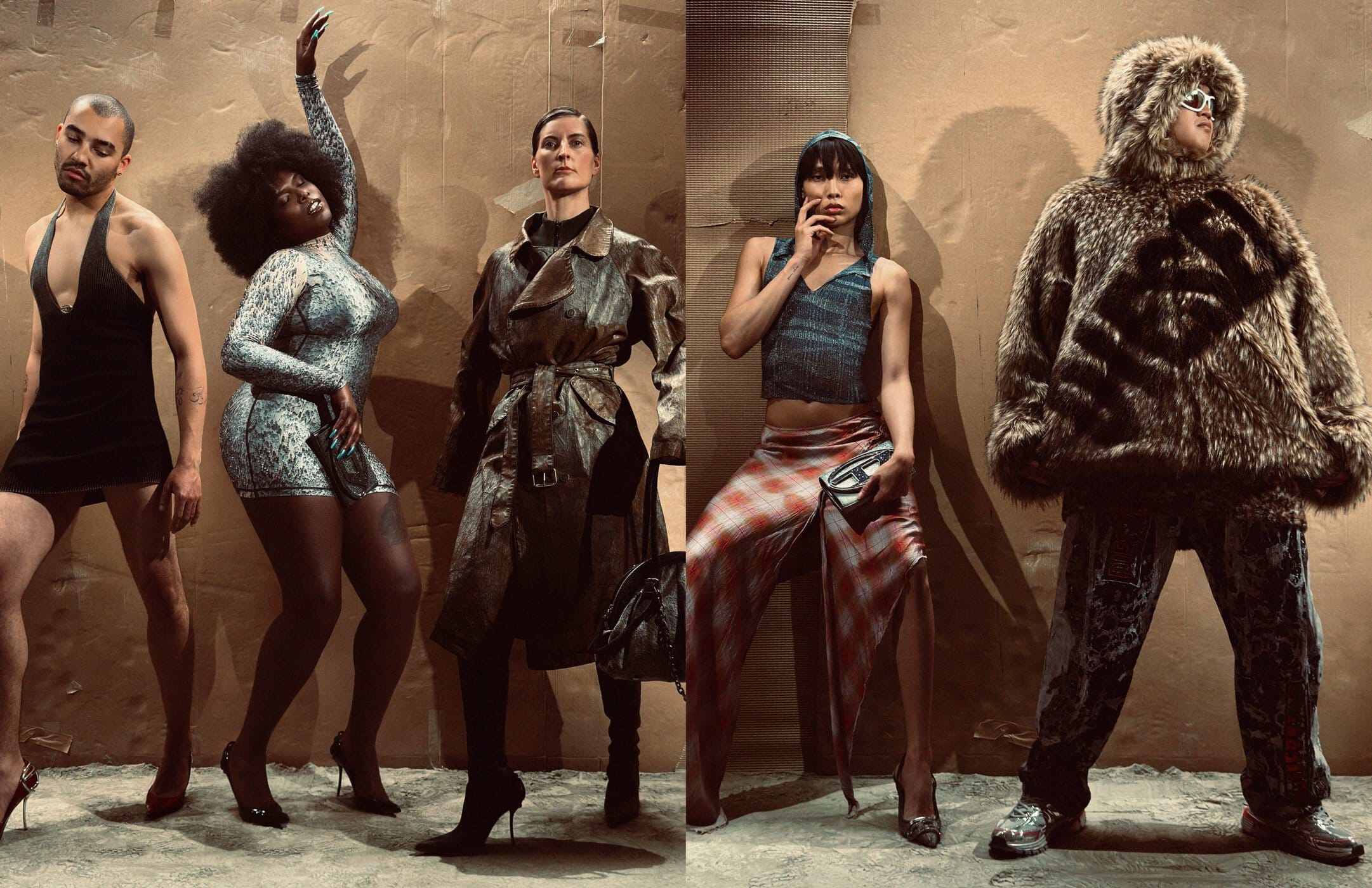 Group of diverse models posing in alternative fashion against a textured cardboard and paper wall backdrop.