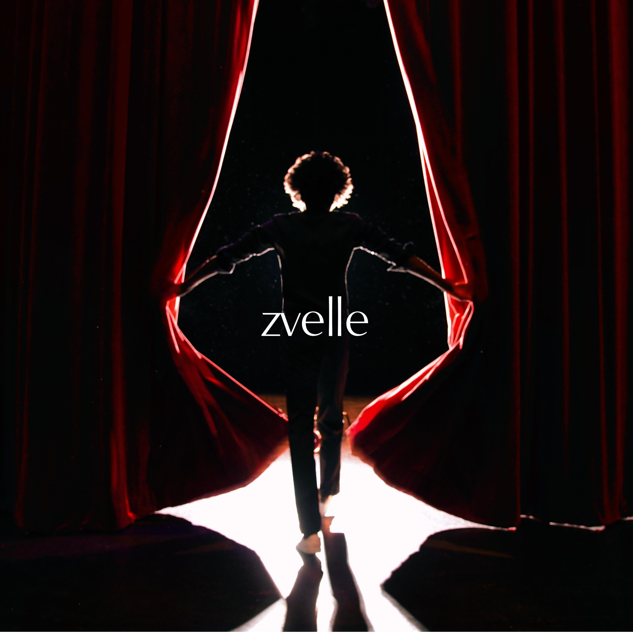 A silhouetted person opening heavy red stage curtains with bright backlight filtering through, creating a dramatic halo effect.