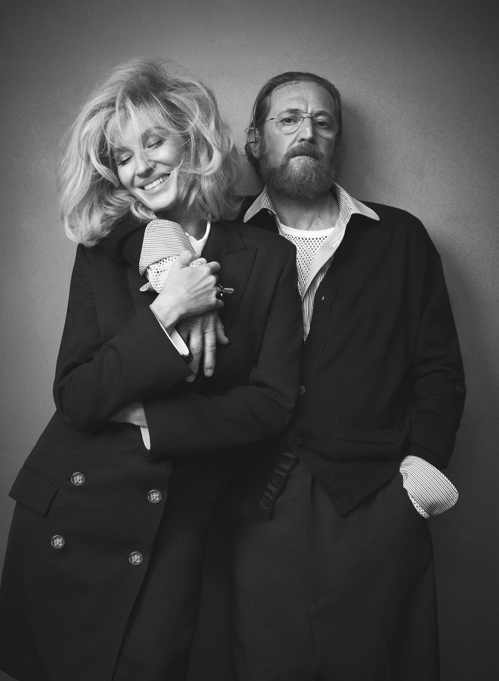 Gisele Bundchen and Stefano Pilati posing in black tailored blazers against a neutral studio backdrop for Zara Fall 2024 ad campaign.