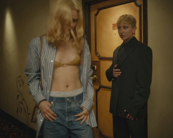 Two models posing in a hotel hallway for Gucci ad campaign shot by Nan Goldin