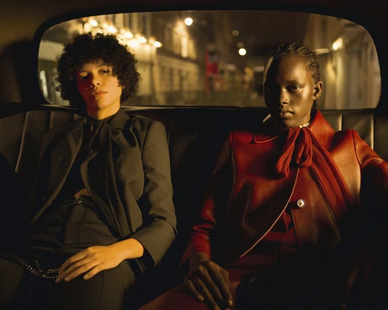 Two models seated in the back of a car at night for the Gucci We Will Always Have London campaign.