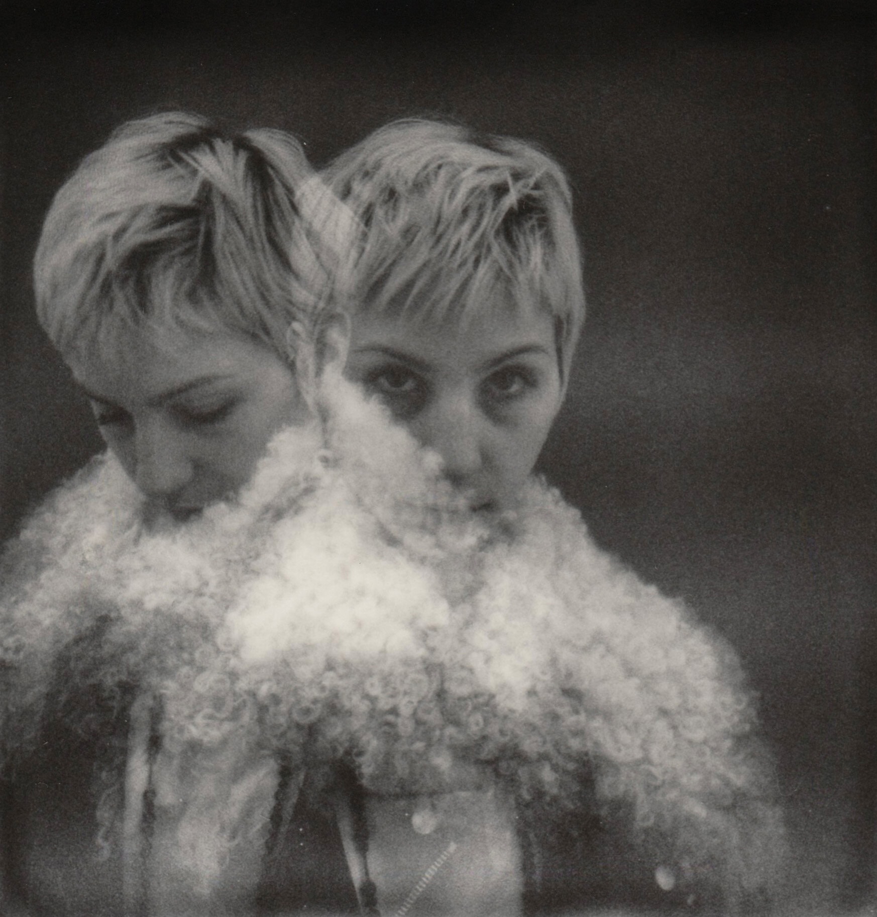 Double exposure portrait of a person with short blonde hair wearing a textured fluffy white collar