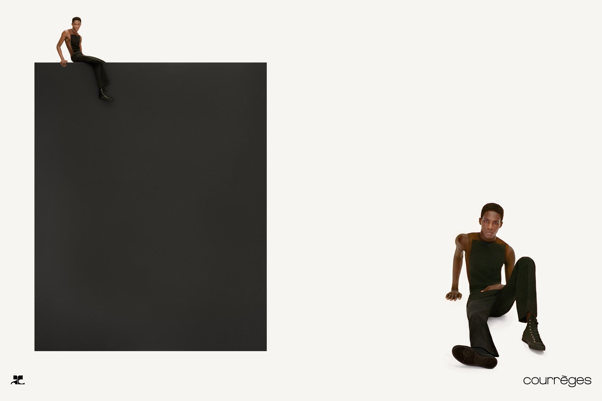 Two black men modeling for Courreges Fall 2024 ad campaign, one seated atop a large dark rectangle against a white background