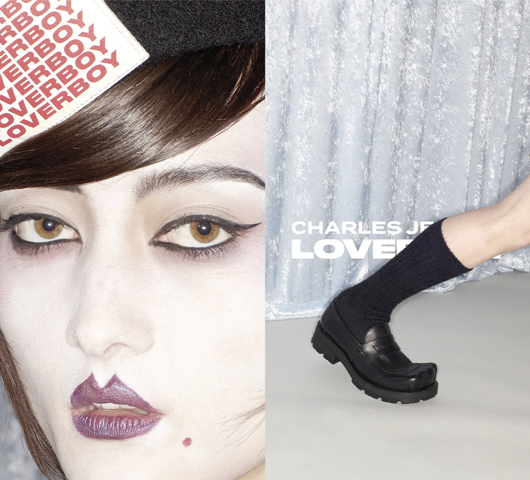 Close-up of a model's face with dramatic winged eyeliner and purple lips next to a foot wearing a black loafer and sock