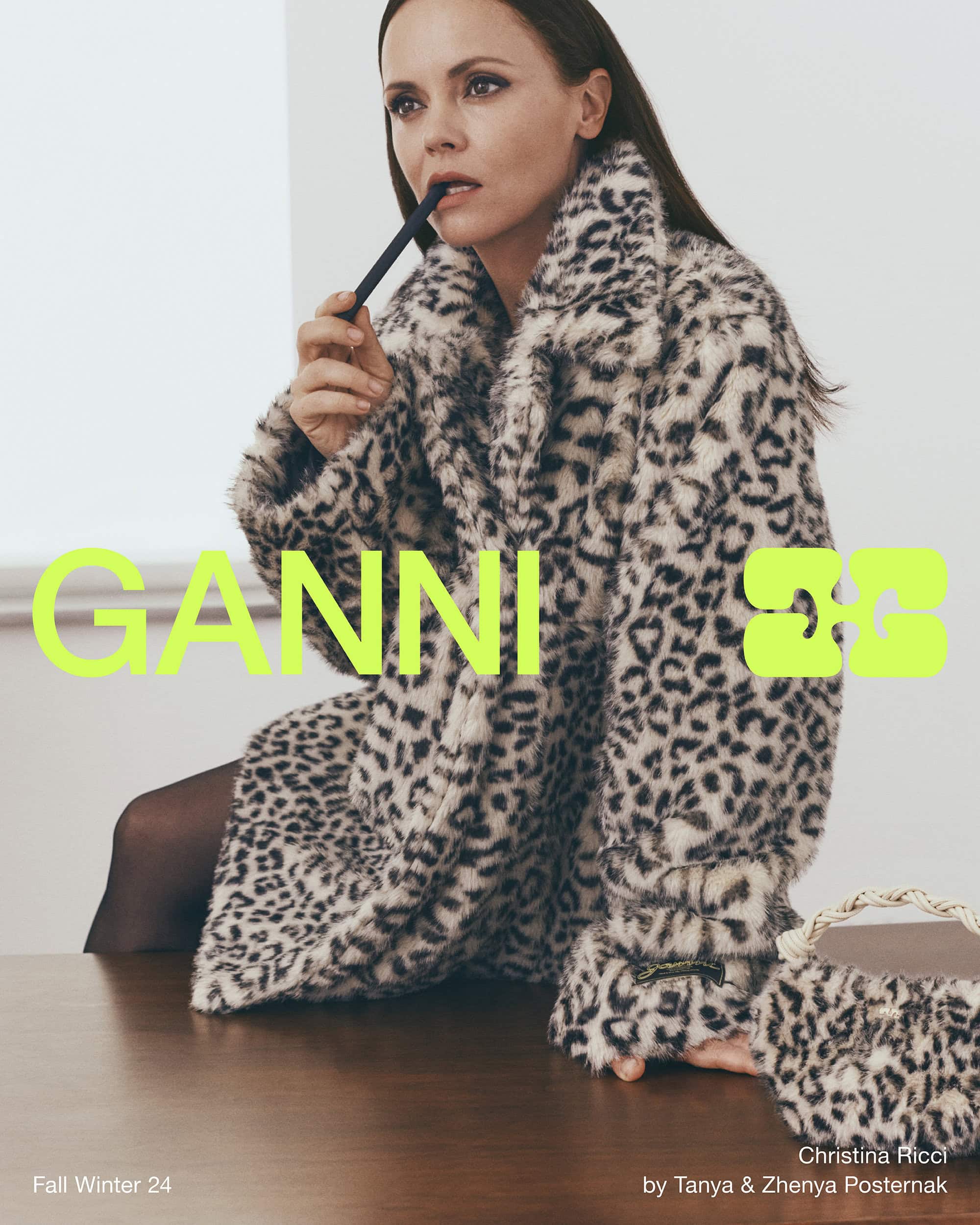 Christina Ricci wearing a leopard print faux fur coat in a Ganni Fall 2024 campaign image shot by Zhenya and Tanya Posternak.