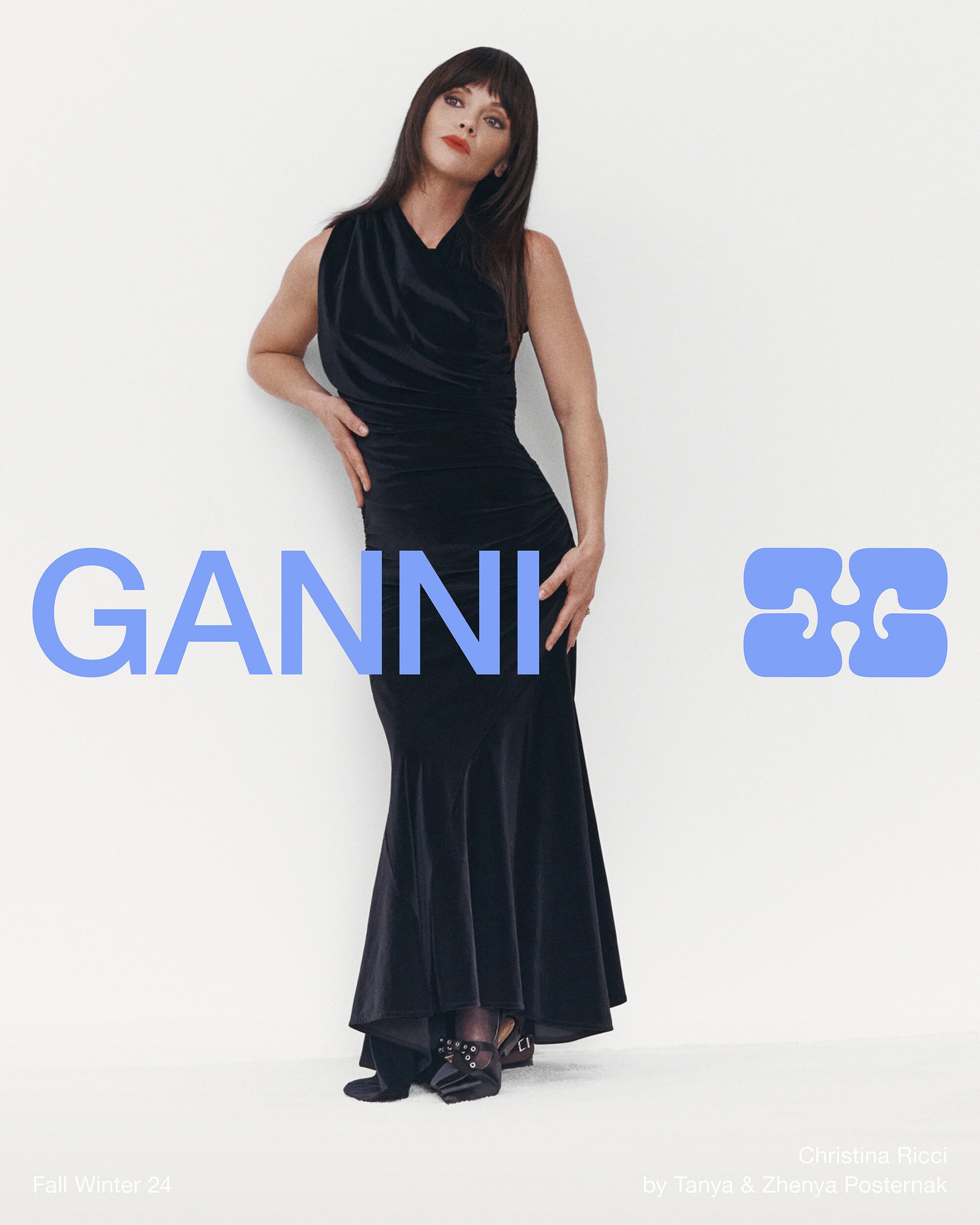 Christina Ricci in a black velvet dress standing against a plain white background for Ganni Fall 2024 ad campaign