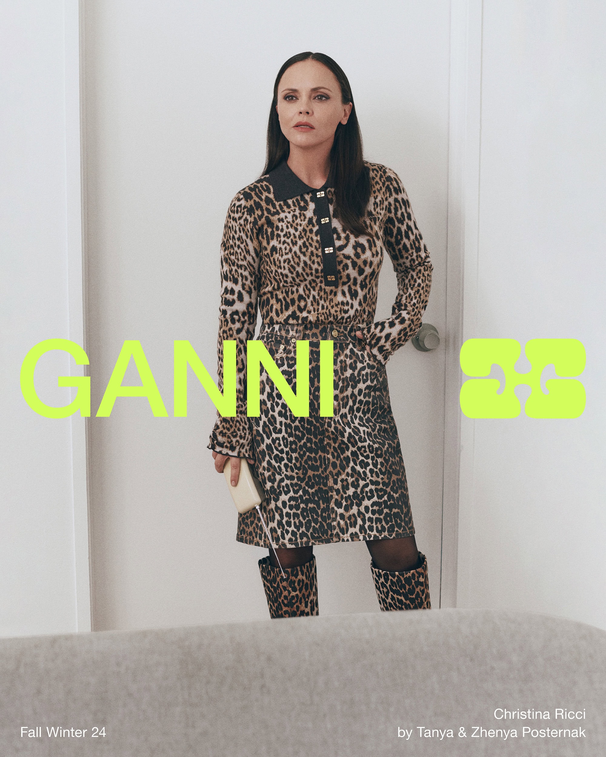Christina Ricci wearing leopard print dress and boots standing in white room for Ganni campaign
