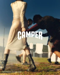Group of models standing on a grassy field outdoors with hanging laundry in the background for Camper Fall 2024 ad campaign