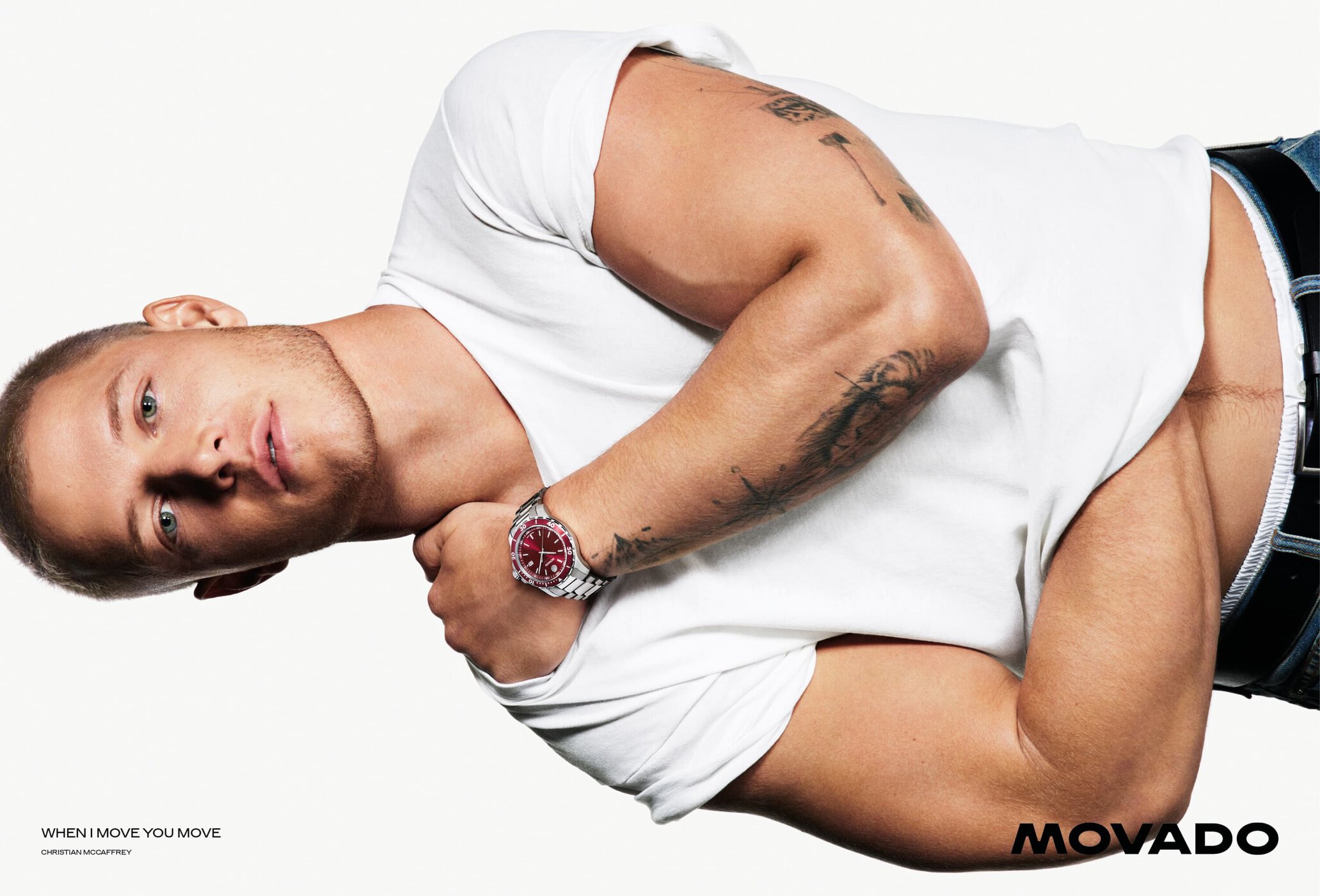 Christian McCaffrey wearing a white t-shirt and steel watch against a white seamless background for Movado