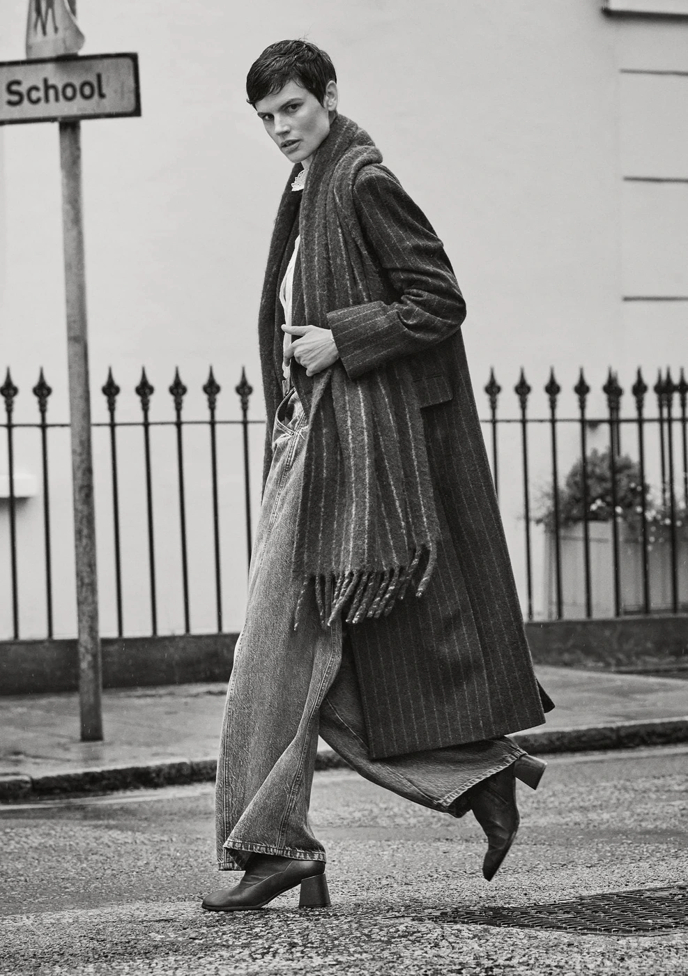 Saskia de Brauw walking on a London street in a long pinstripe coat and scarf for ME+EM Fall 2024 campaign, photographed by Cass Bird.