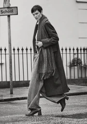 Saskia de Brauw walking on a London street in a long pinstripe coat and scarf for ME+EM Fall 2024 campaign, photographed by Cass Bird.