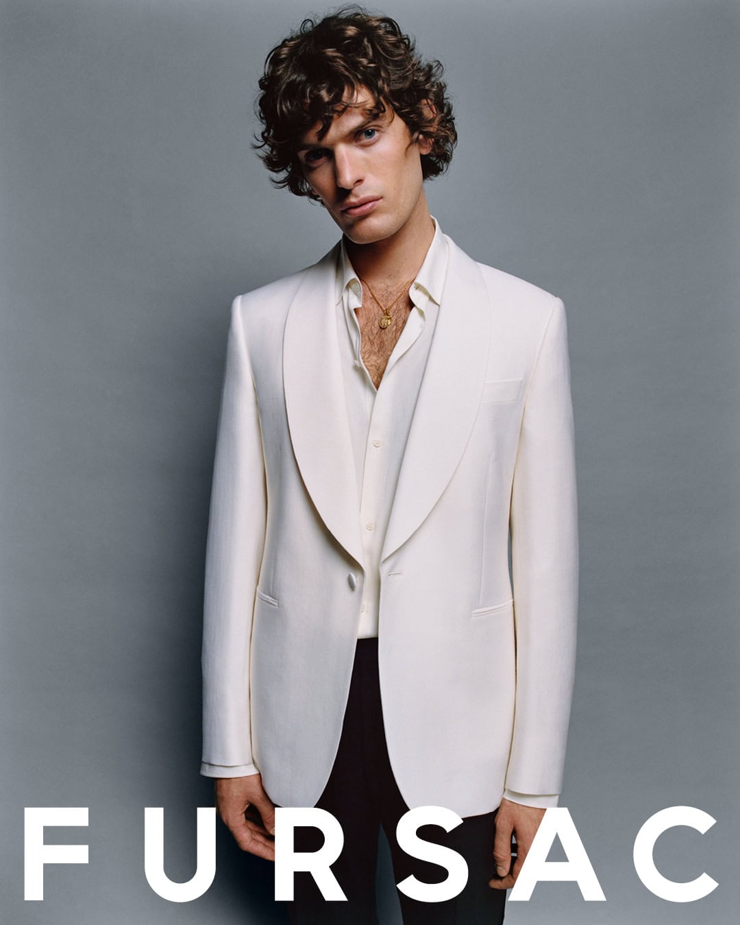 Model Lorenzo Sutto Lewis wearing a white jacket for Fursac Fall 2024 ad campaign