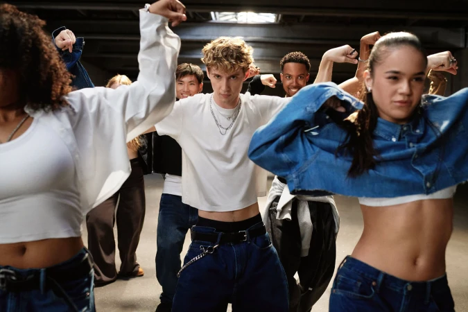 Troye Sivan and dancers posing in casual streetwear for Gap Get Loose campaign