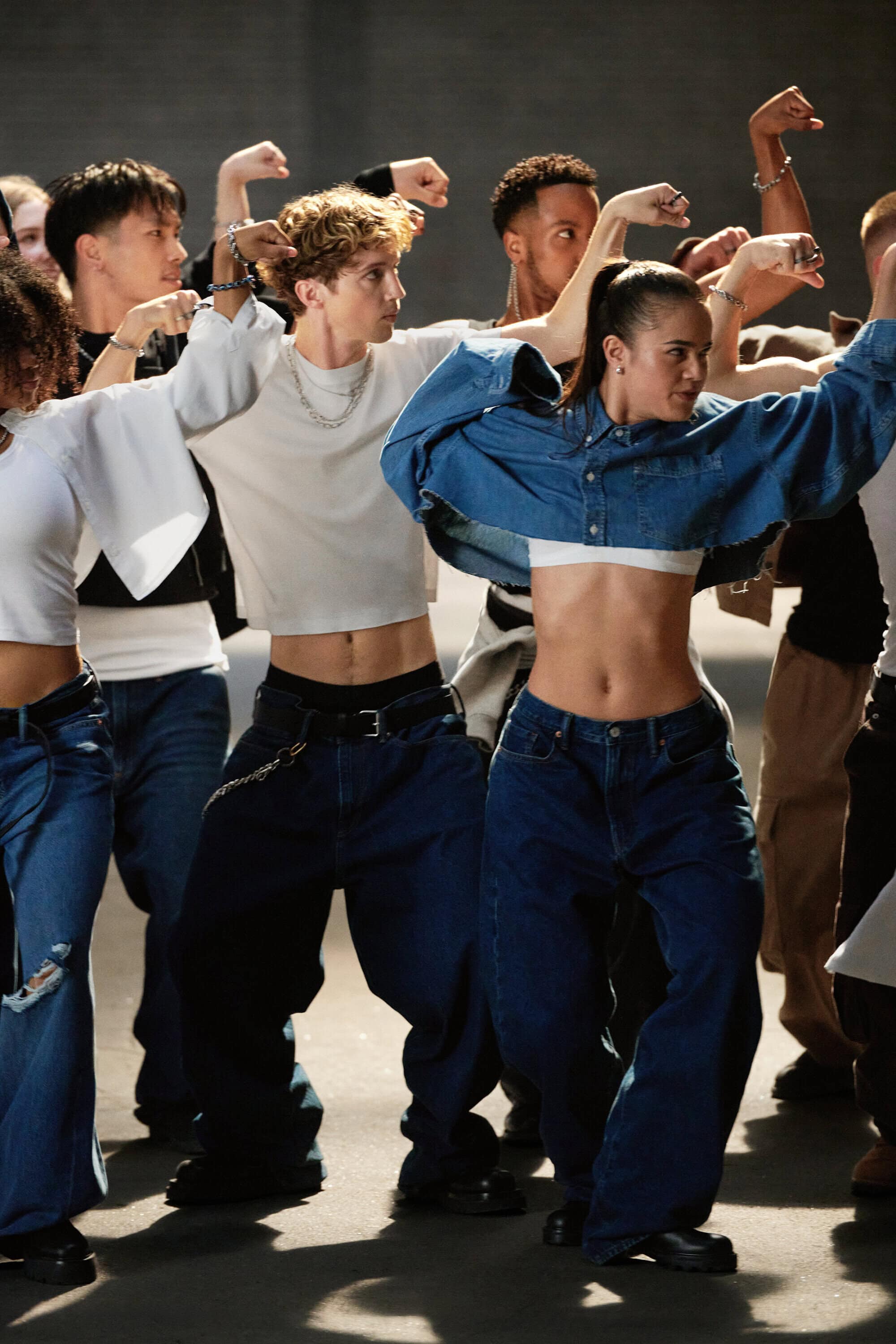 Troye Sivan and a group of dancers performing in denim and white tops for Gap Fall 2024 campaign directed by Dan Martensen