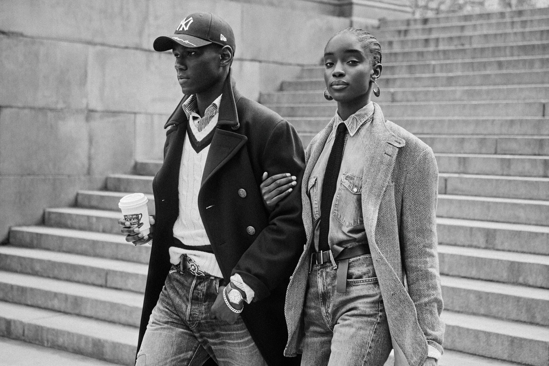 Black and white portrait of a black man and woman walking down stone steps for Ralph Lauren New York campaign