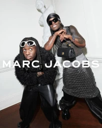 Kai Cenat and Lil Uzi Vert pose for Marc Jacobs Fall 2024 ad campaign wearing black designer apparel and sunglasses in a white interior